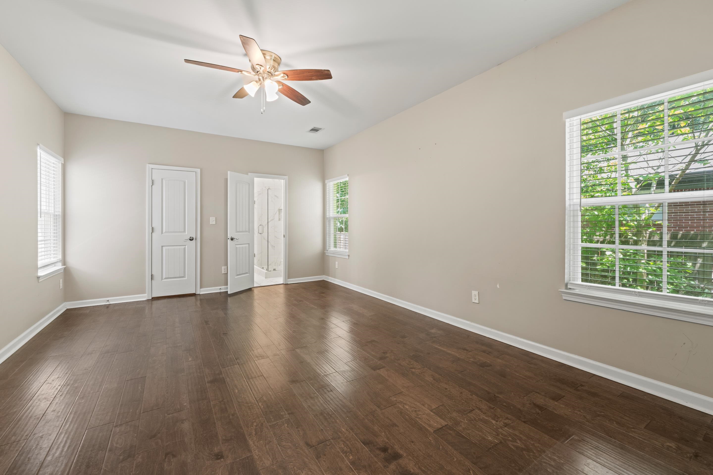 1255 Colonial Road Memphis, TN 38117 - Photo 14 of 30 Spacious interior room featuring wood-finish flooring, light-colored walls, and a ceiling fan