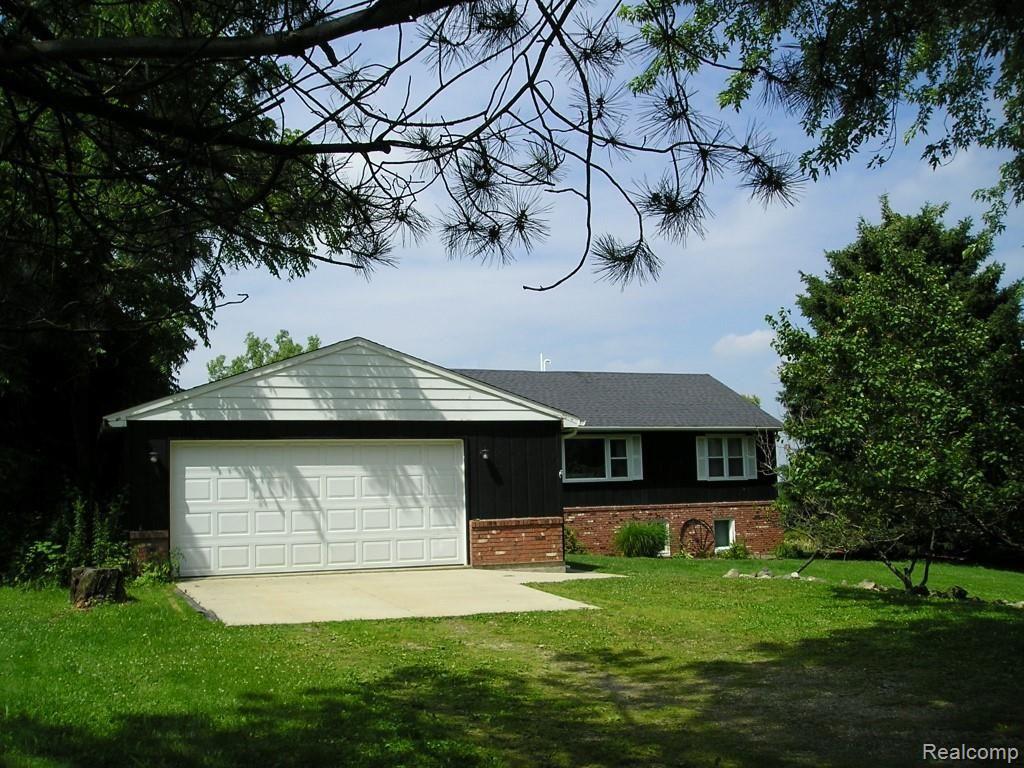 6353 Hough Road Almont, MI 48003 - Photo 2 of 26 Front of detached garage showing front of house in the background
