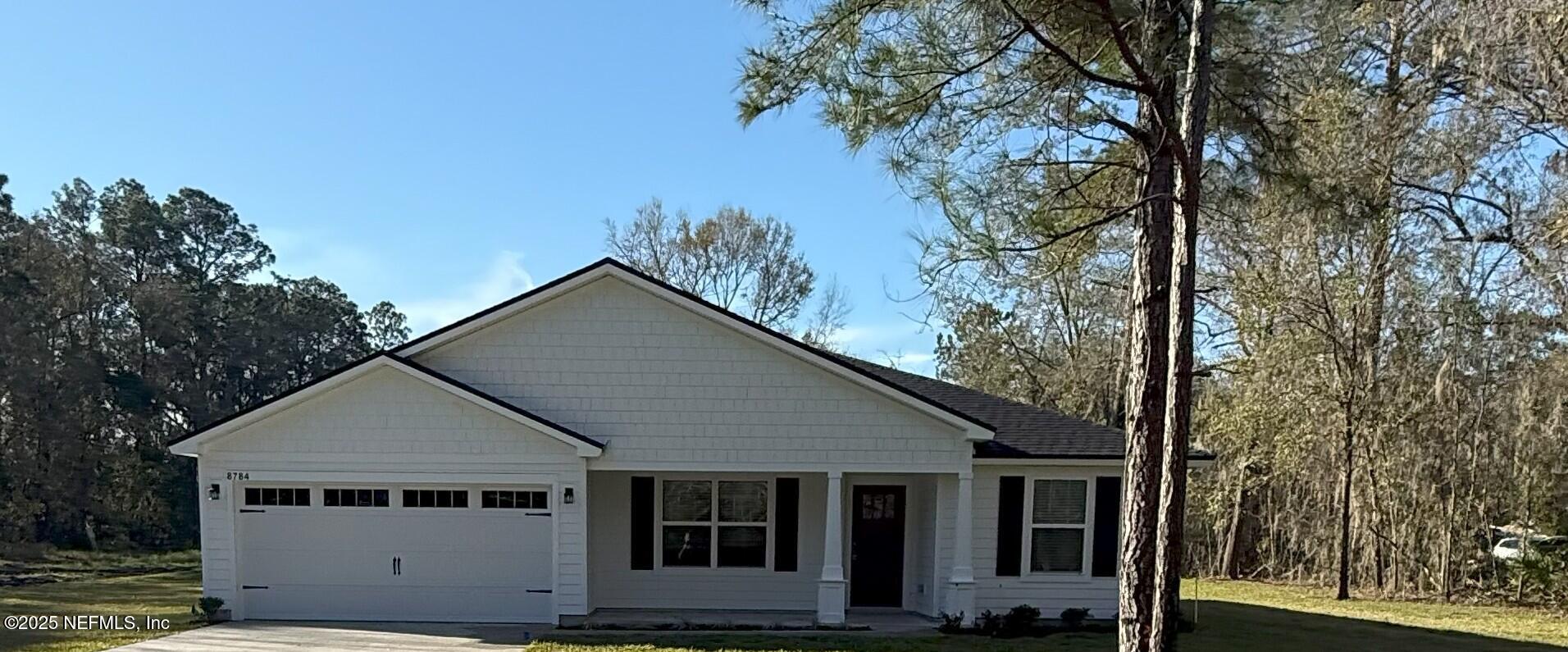 8784 Orme Road Jacksonville, FL 32220 - Photo 1 of 45 front view of a house with a trees