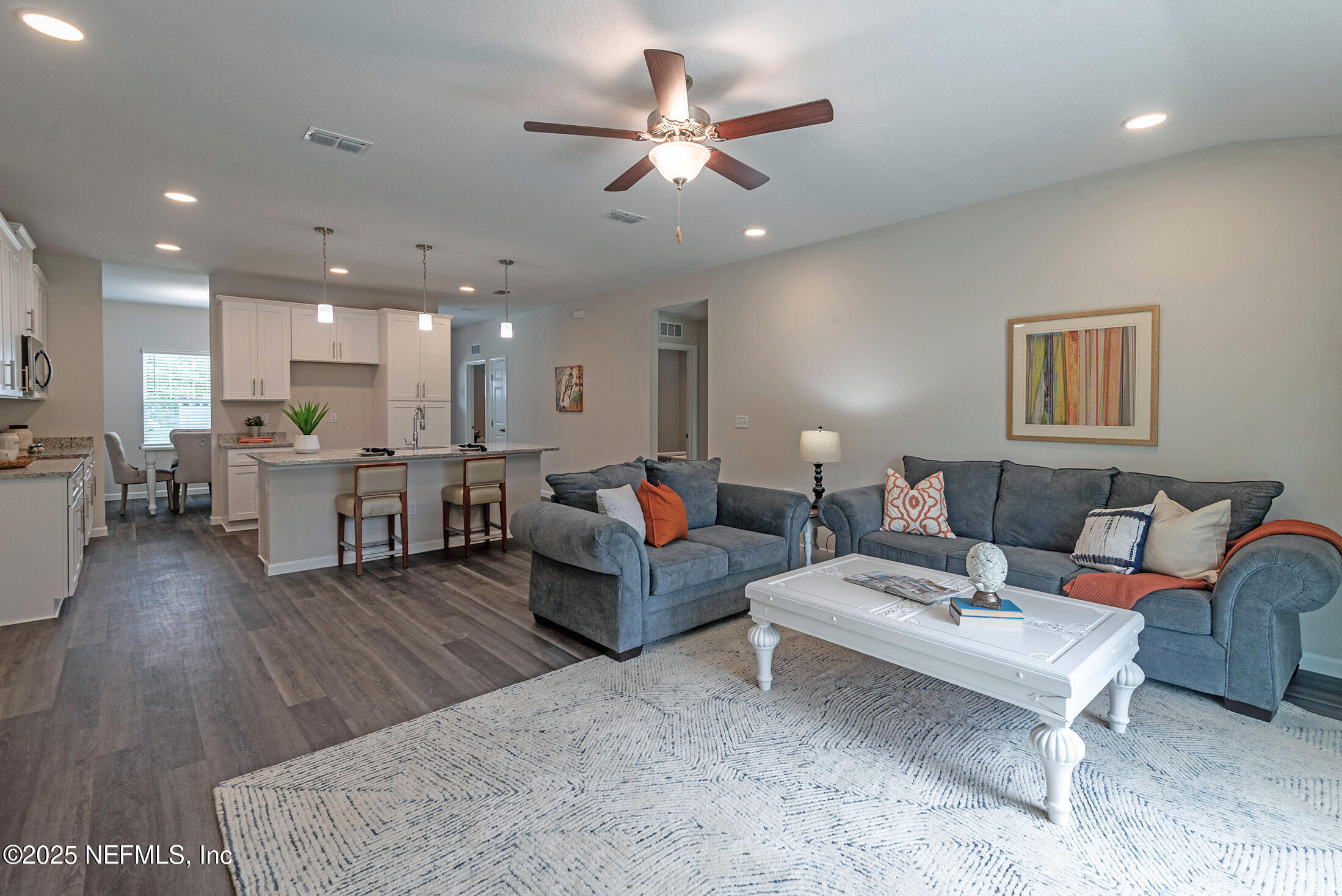 8784 Orme Road Jacksonville, FL 32220 - Photo 19 of 45 a living room with furniture and kitchen view