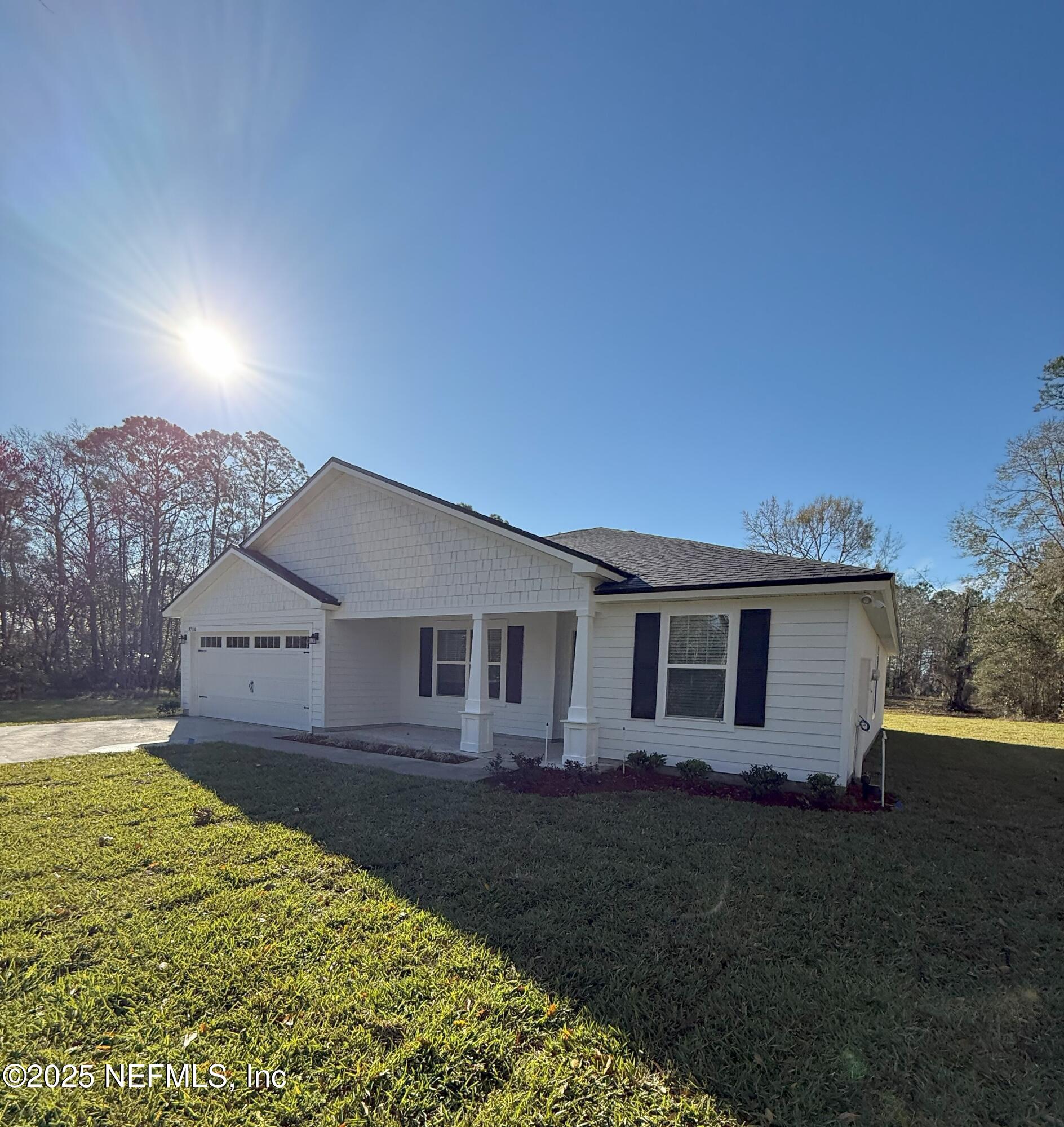 8784 Orme Road Jacksonville, FL 32220 - Photo 2 of 45 front view of a house with a yard