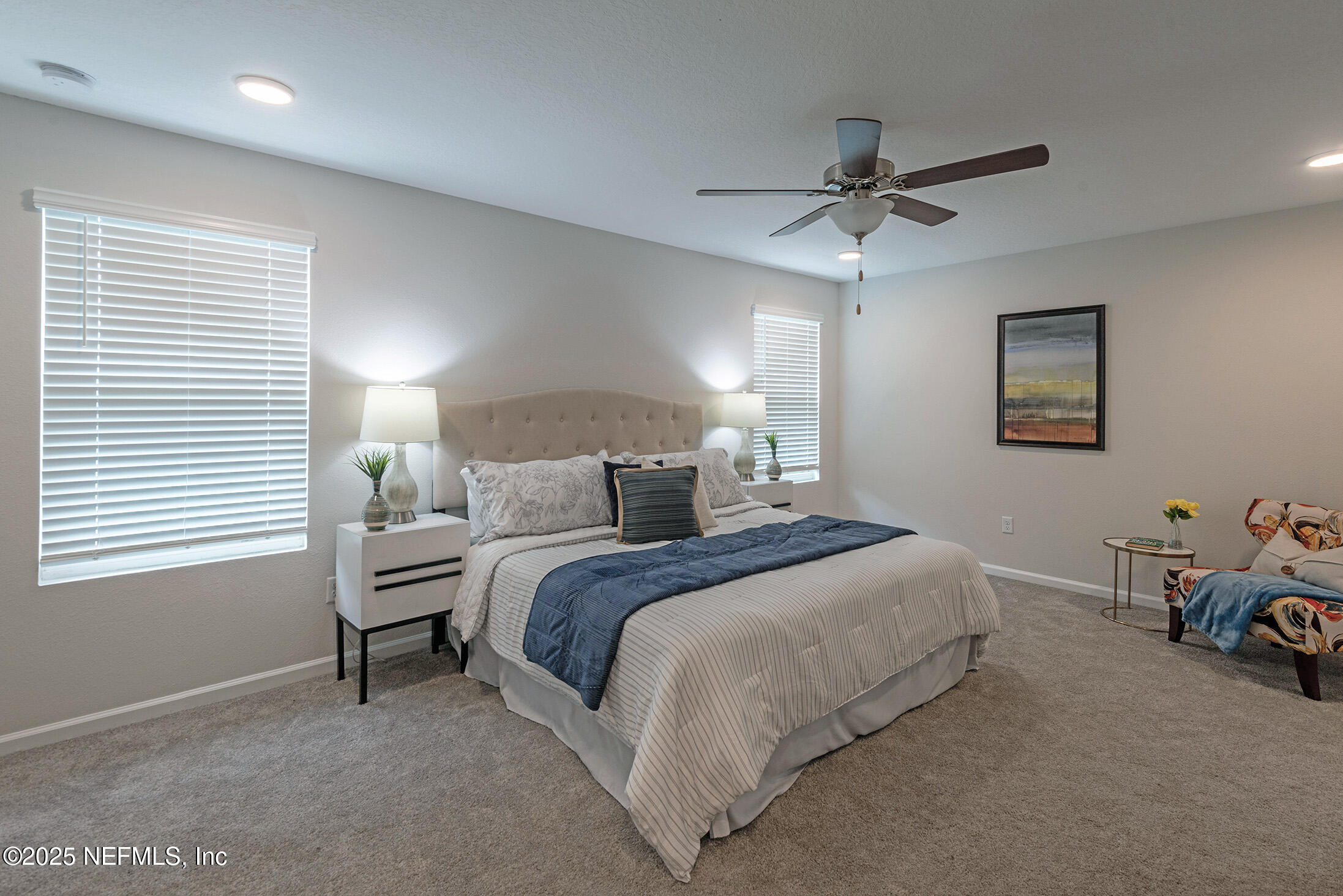 8784 Orme Road Jacksonville, FL 32220 - Photo 21 of 45 a bedroom with a bed a couch and a window