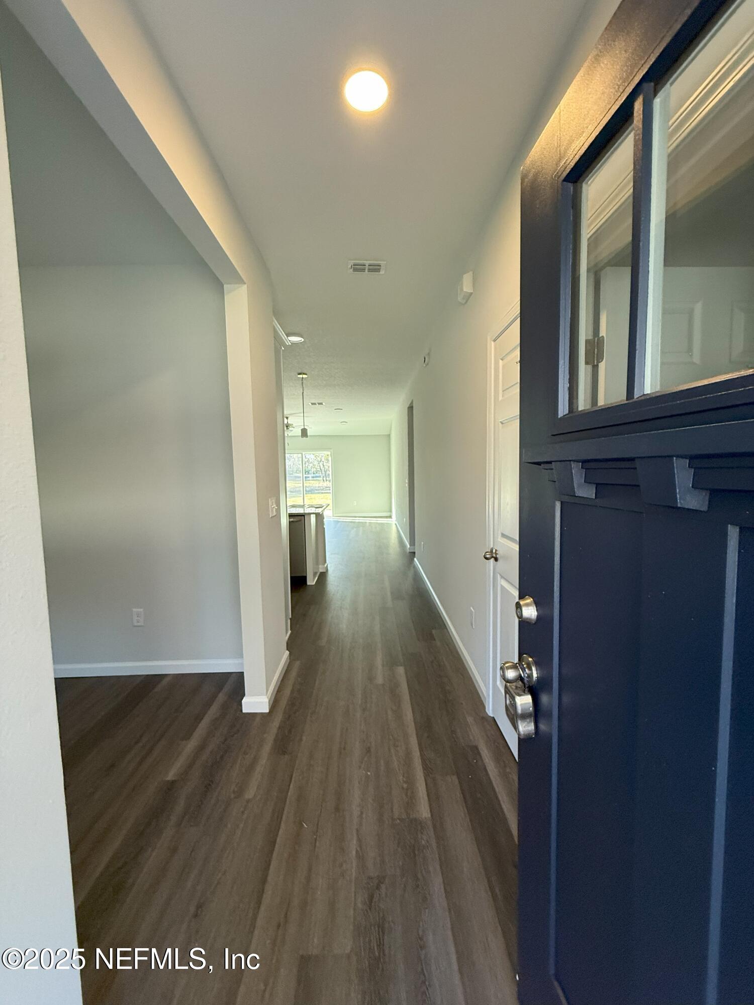 8784 Orme Road Jacksonville, FL 32220 - Photo 3 of 45 a view of hallway with wooden floor