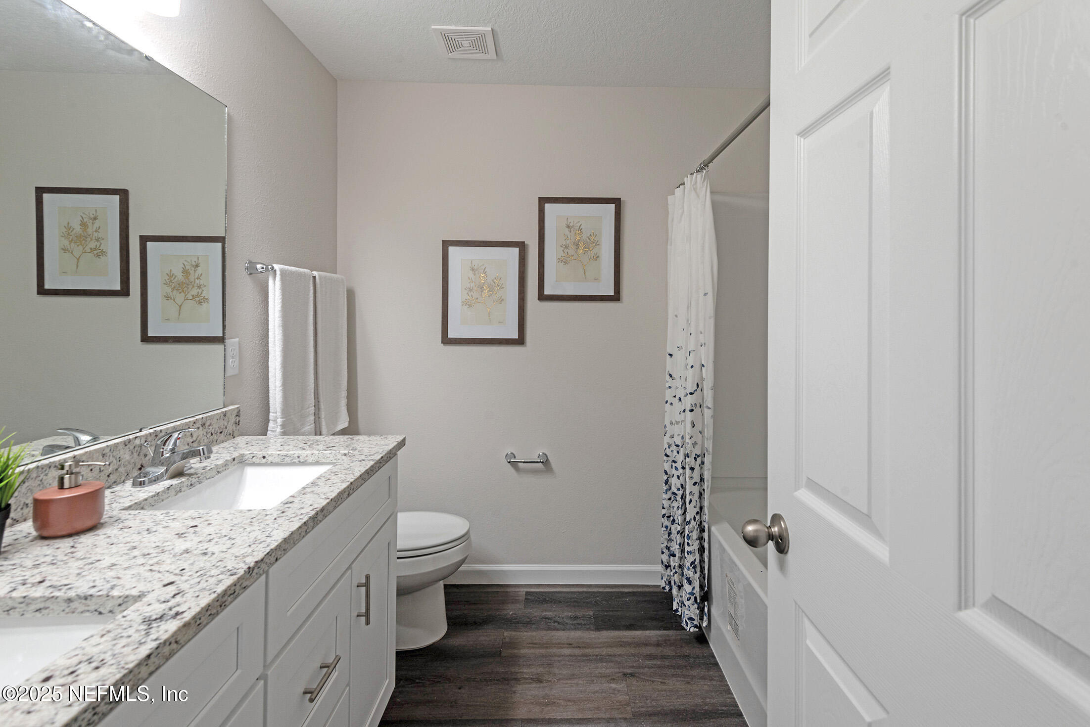 8784 Orme Road Jacksonville, FL 32220 - Photo 35 of 45 a bathroom with a granite countertop sink toilet and shower