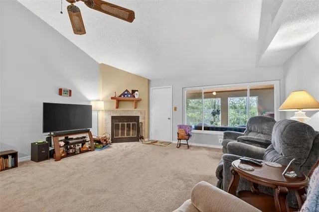 a view of a livingroom with furniture and a fireplace