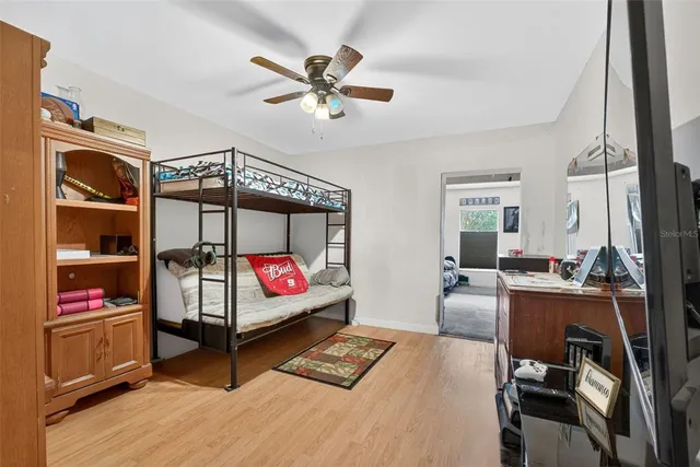 a bedroom with a bed and a cabinets