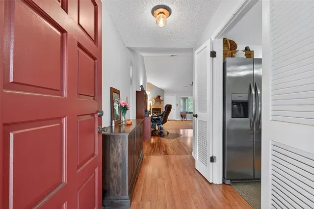 a view of a livingroom with furniture and a flat screen tv