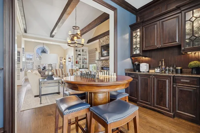 a dining room with furniture and wooden floor