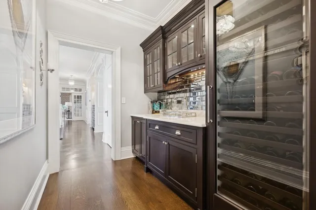 a bathroom with a sink and a glass door shower