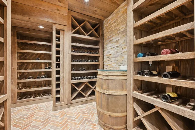 a bedroom with a bed and wall painting