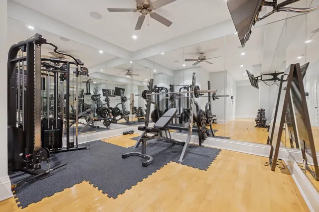 a bathroom with a toilet a sink and a mirror