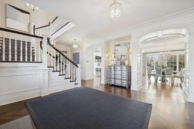 a view of empty room with wooden floor and windows