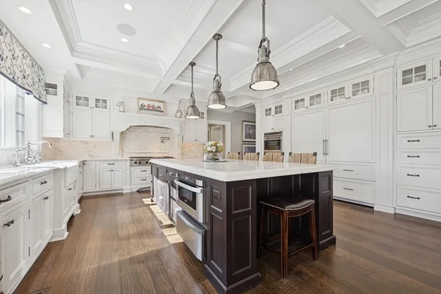 a kitchen with wooden cabinets and center island
