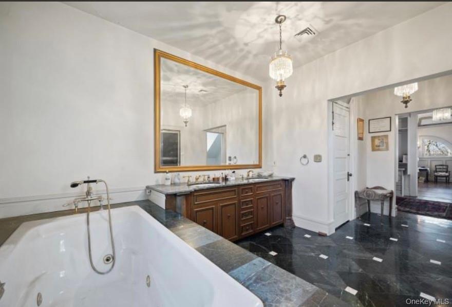 117 Leber Road Blauvelt, NY 10913 - Photo 22 of 23 a bathroom with a tub sink and mirror