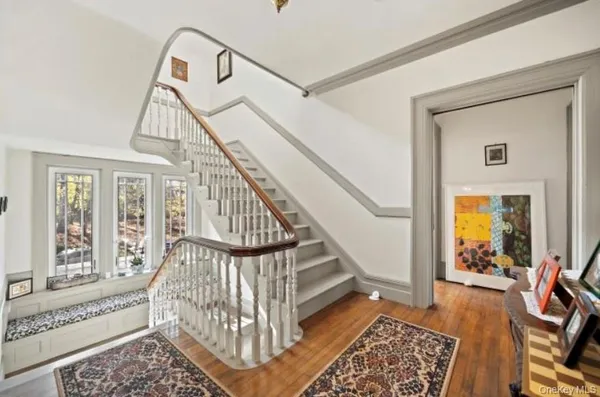 a view of entryway with wooden floor