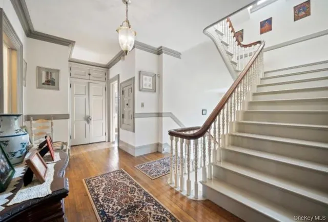a view of entryway with wooden floor