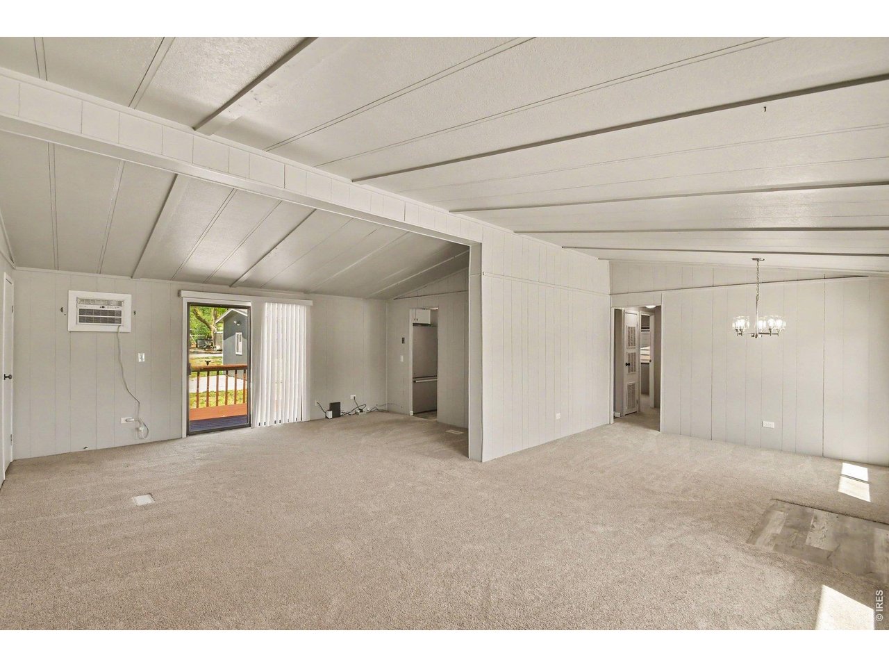 8317 6th Street Wellington, CO 80549 - Photo 5 of 21 Open-concept living and dining spaces
