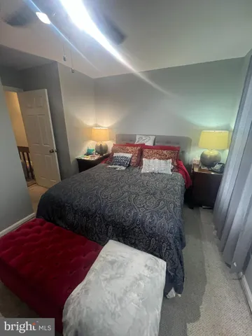 a bedroom with bed and window