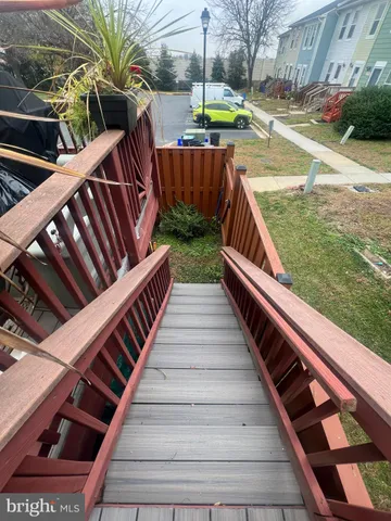 a view of outdoor space with barbeque grill and wooden fence