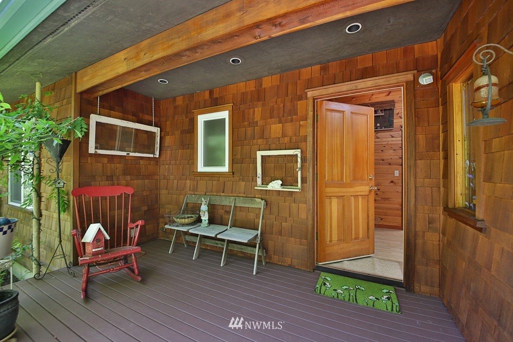 3608 East Harbor Road Langley, WA 98260 - Photo 3 of 25 a backyard of a house with outdoor seating