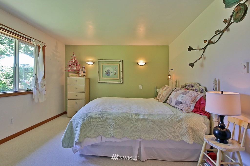 3608 East Harbor Road Langley, WA 98260 - Photo 10 of 25 a bedroom with a bed and a window