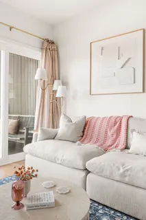 a living room with a couch and a table