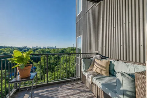 a view of a couches in the balcony