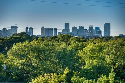a view of a city with tall buildings in the background