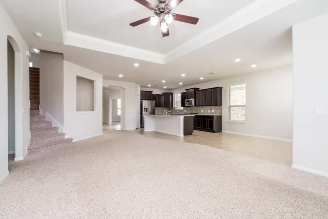 a view of a kitchen with a sink and a stove top oven