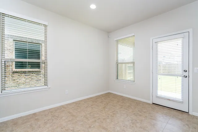 an empty room with windows