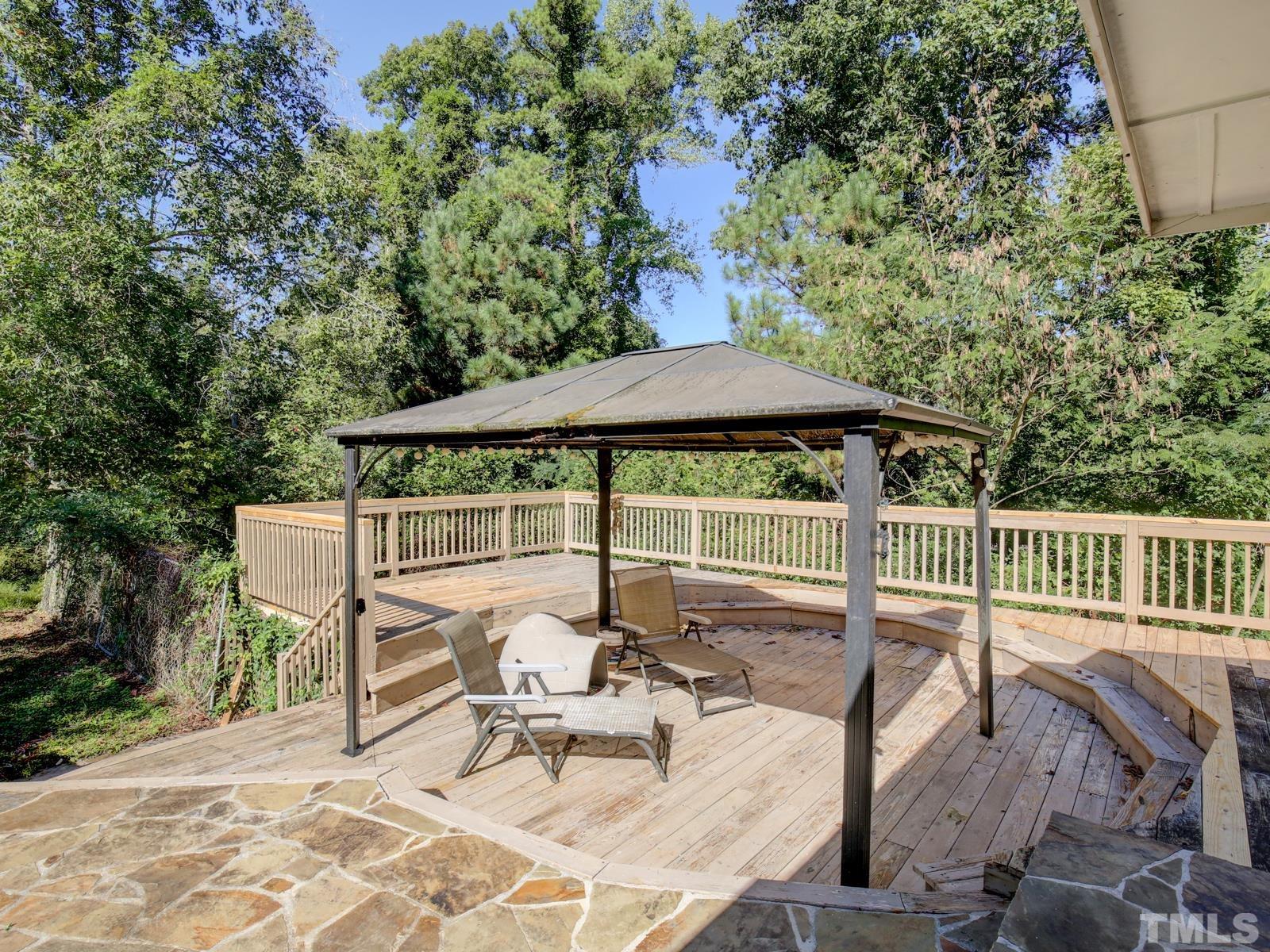 12911 Boyce Mill Road Raleigh, NC 27613 - Photo 22 of 27 a view of a chair and table in the patio