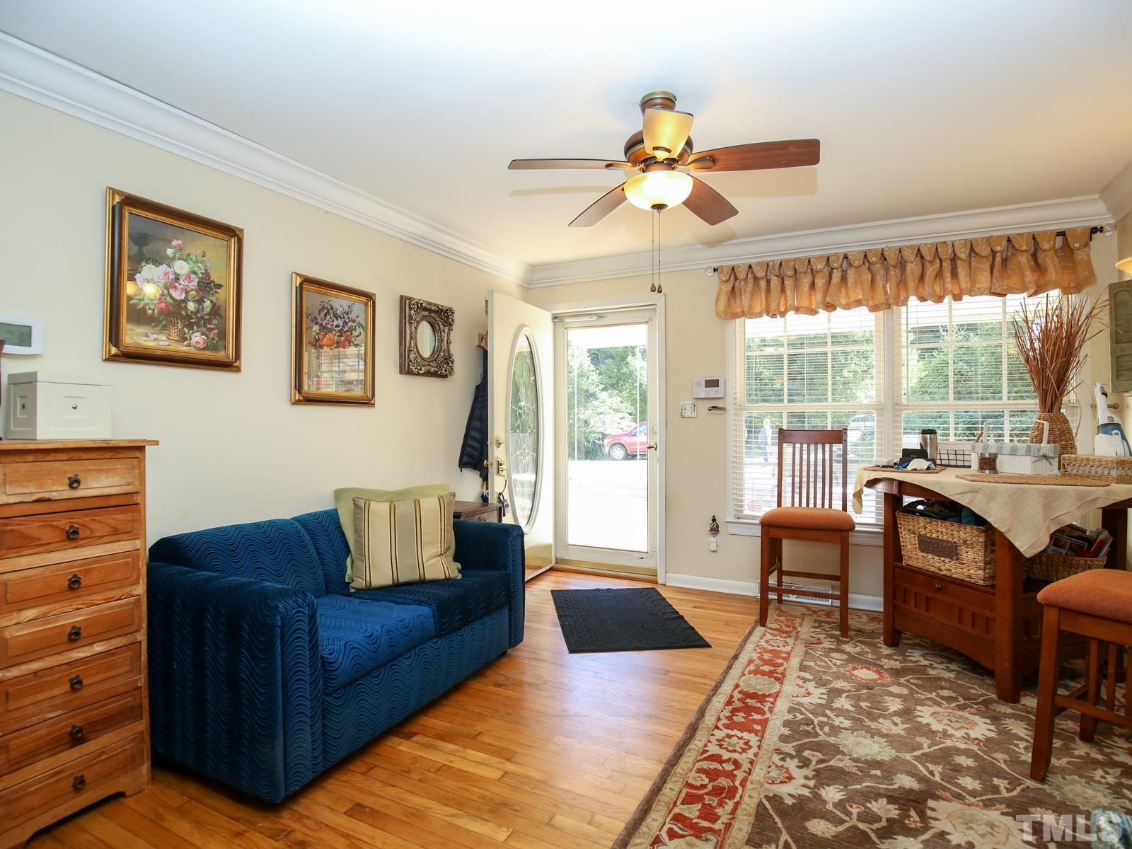 12911 Boyce Mill Road Raleigh, NC 27613 - Photo 8 of 27 a living room with furniture and a large window
