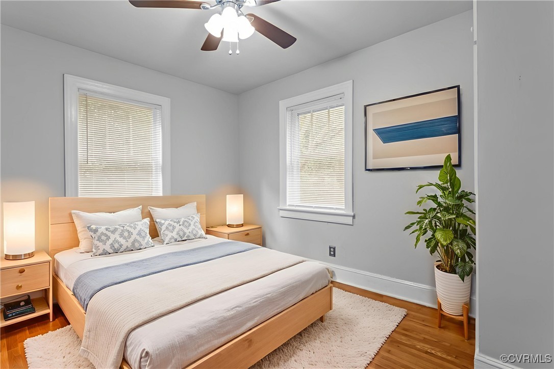 14831 Harrowgate Road Chester, VA 23831 - Photo 14 of 33 a bedroom with a bed and a potted plant