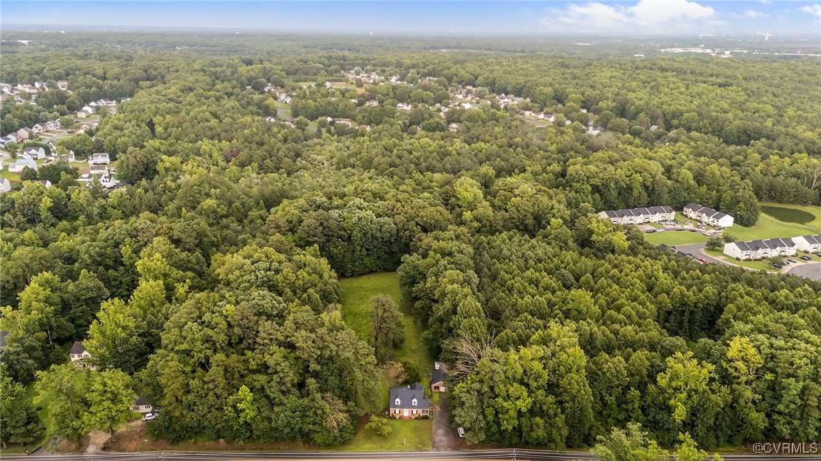 14831 Harrowgate Road Chester, VA 23831 - Photo 28 of 33 an aerial view of residential houses with outdoor space and trees