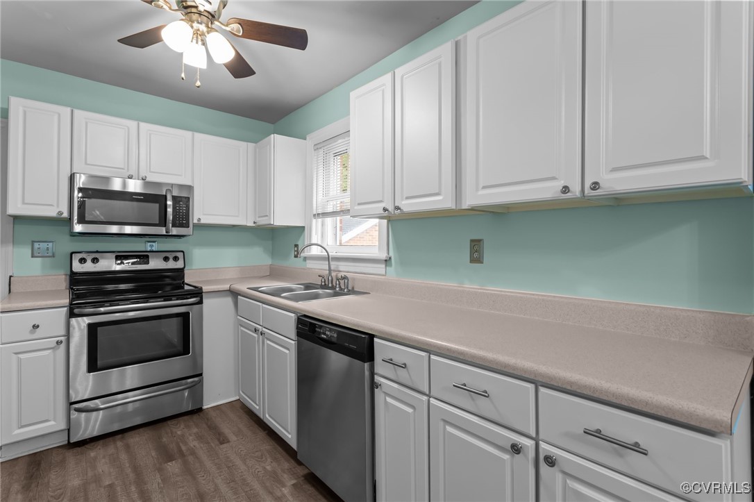 14831 Harrowgate Road Chester, VA 23831 - Photo 4 of 33 a kitchen with cabinets appliances and a sink