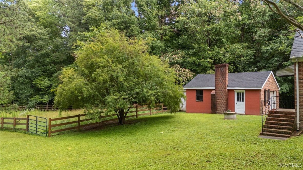 14831 Harrowgate Road Chester, VA 23831 - Photo 5 of 33 front view of a house with a yard