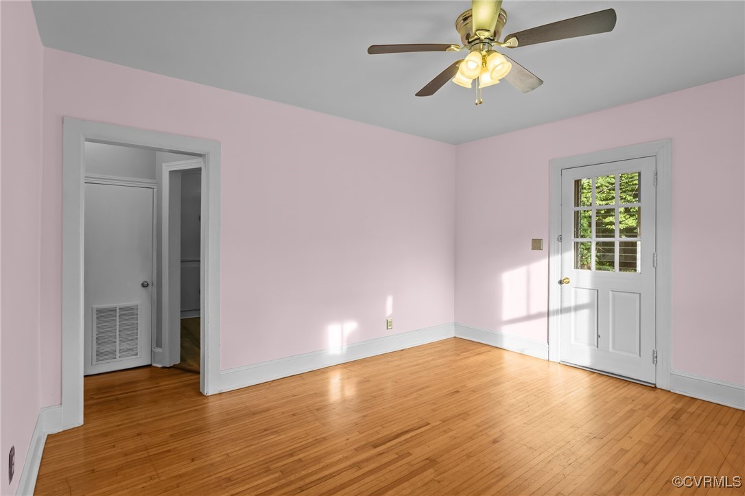 14831 Harrowgate Road Chester, VA 23831 - Photo 8 of 33 a view of empty room with wooden floor and fan