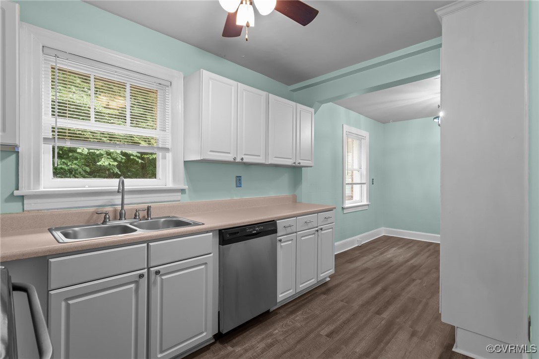 14831 Harrowgate Road Chester, VA 23831 - Photo 10 of 33 a kitchen with a sink cabinets and window