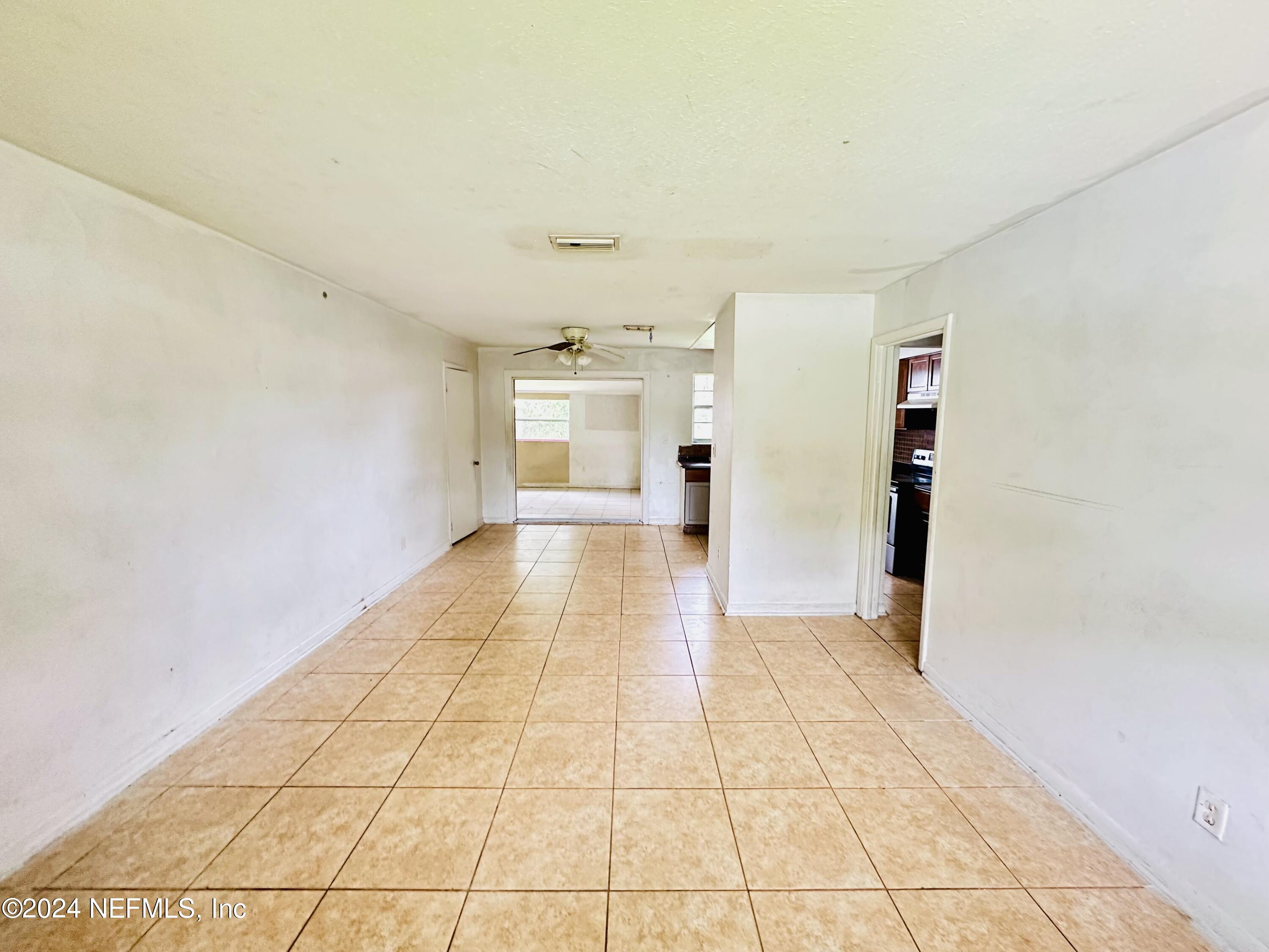 5521 Sabena Road Jacksonville, FL 32207 - Photo 9 of 13 a view of empty room with wooden floor