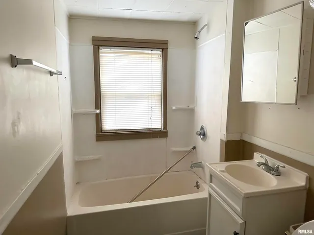 a bathroom with a sink and a bathtub