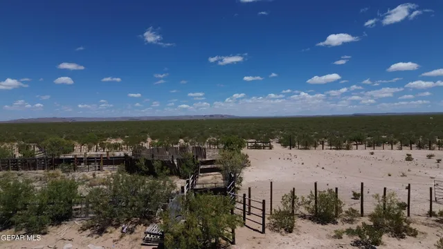 a view of a patio with a table chairs and a umbrella