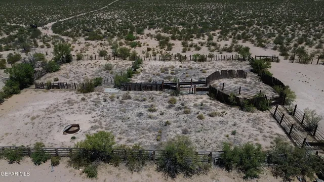 a view of a ocean from a floor to ceiling window
