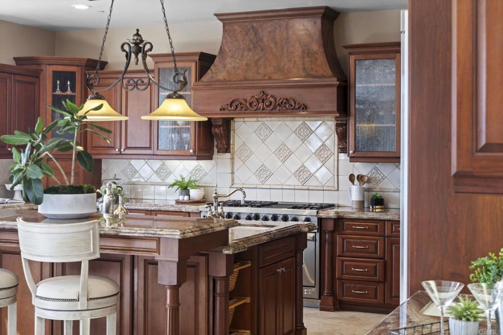 1160 Little Gopher Canyon Road Vista, CA 92084 - Photo 11 of 45 a kitchen with a stove and a wooden cabinets