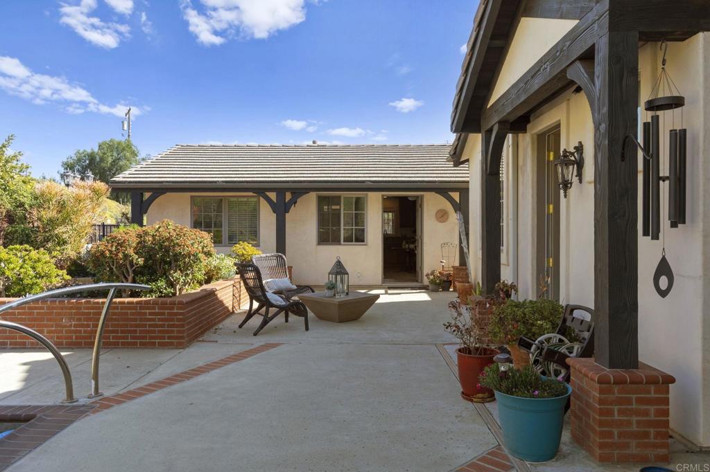 1160 Little Gopher Canyon Road Vista, CA 92084 - Photo 25 of 45 a view of a patio with couches chairs and potted plants