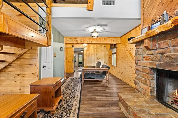 a balcony with furniture and wooden floor