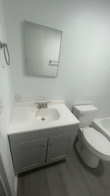 8897 Southwest 34th Court Ocala, FL 34476 - Photo 18 of 18 a bathroom with a sink toilet and mirror
