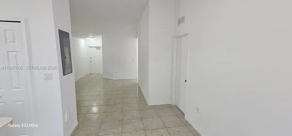 an empty room with white walls