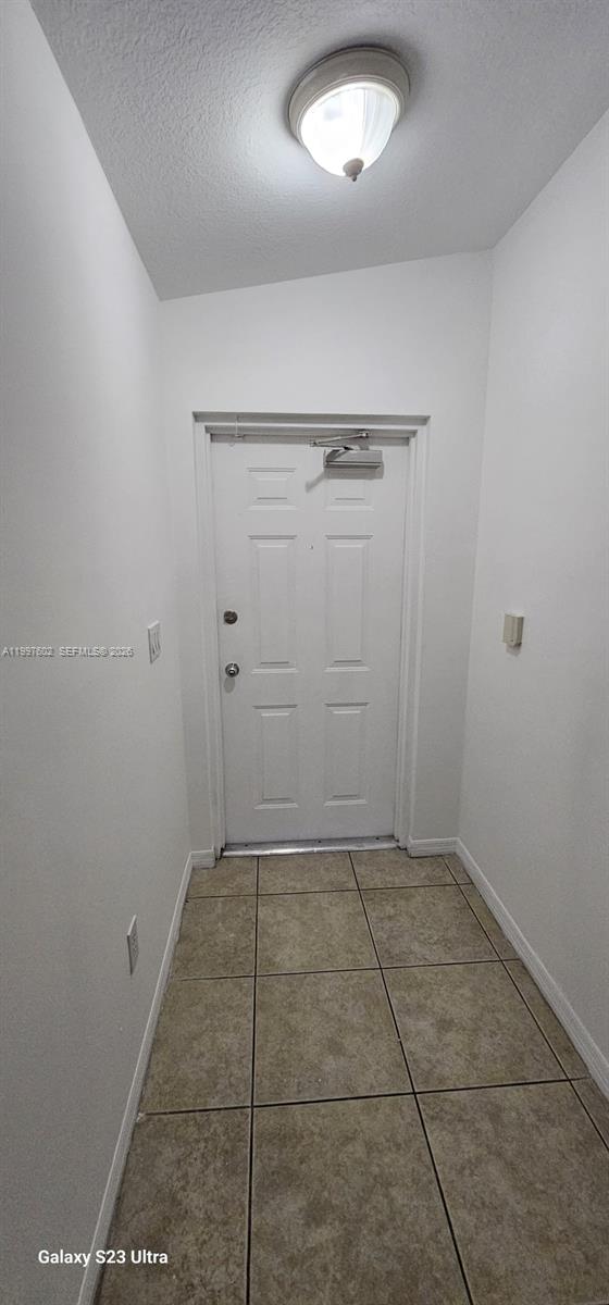 935 Northeast 33rd Terrace, Unit 204 Homestead, FL 33033 - Photo 12 of 28 an empty room with white walls