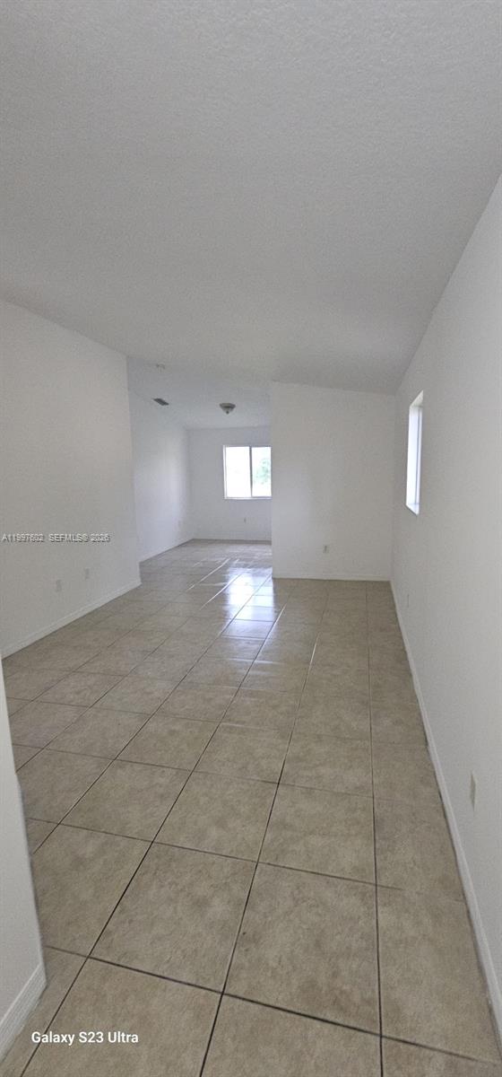 935 Northeast 33rd Terrace, Unit 204 Homestead, FL 33033 - Photo 13 of 28 a view of empty room