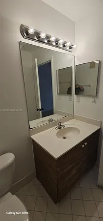 a view of an empty room and a window